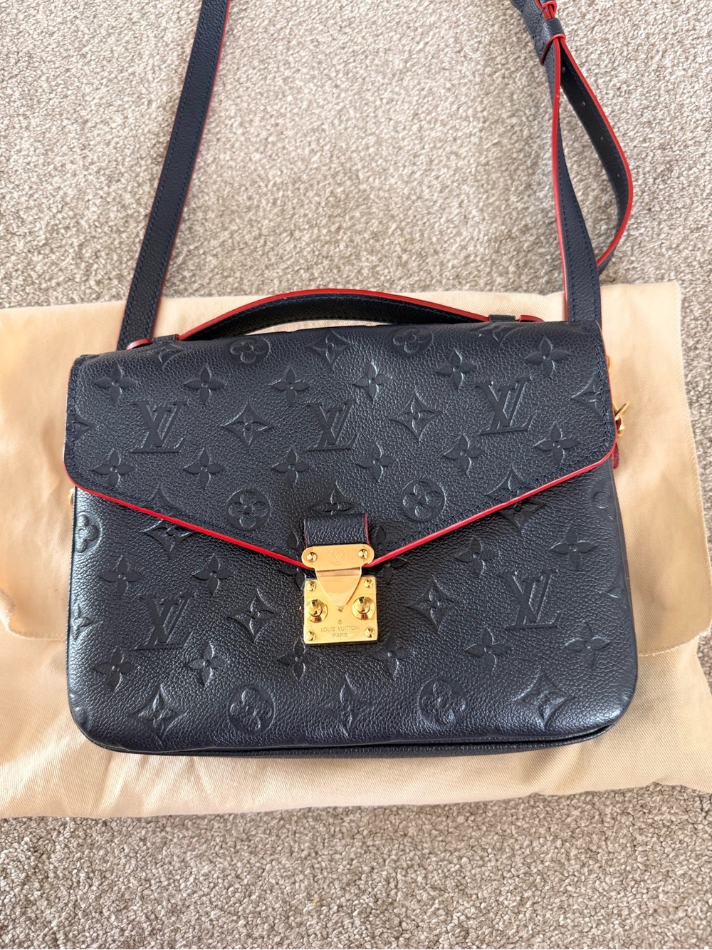 Louis Vuitton Pochette mentis top handle crossbody leather Gold Hardware